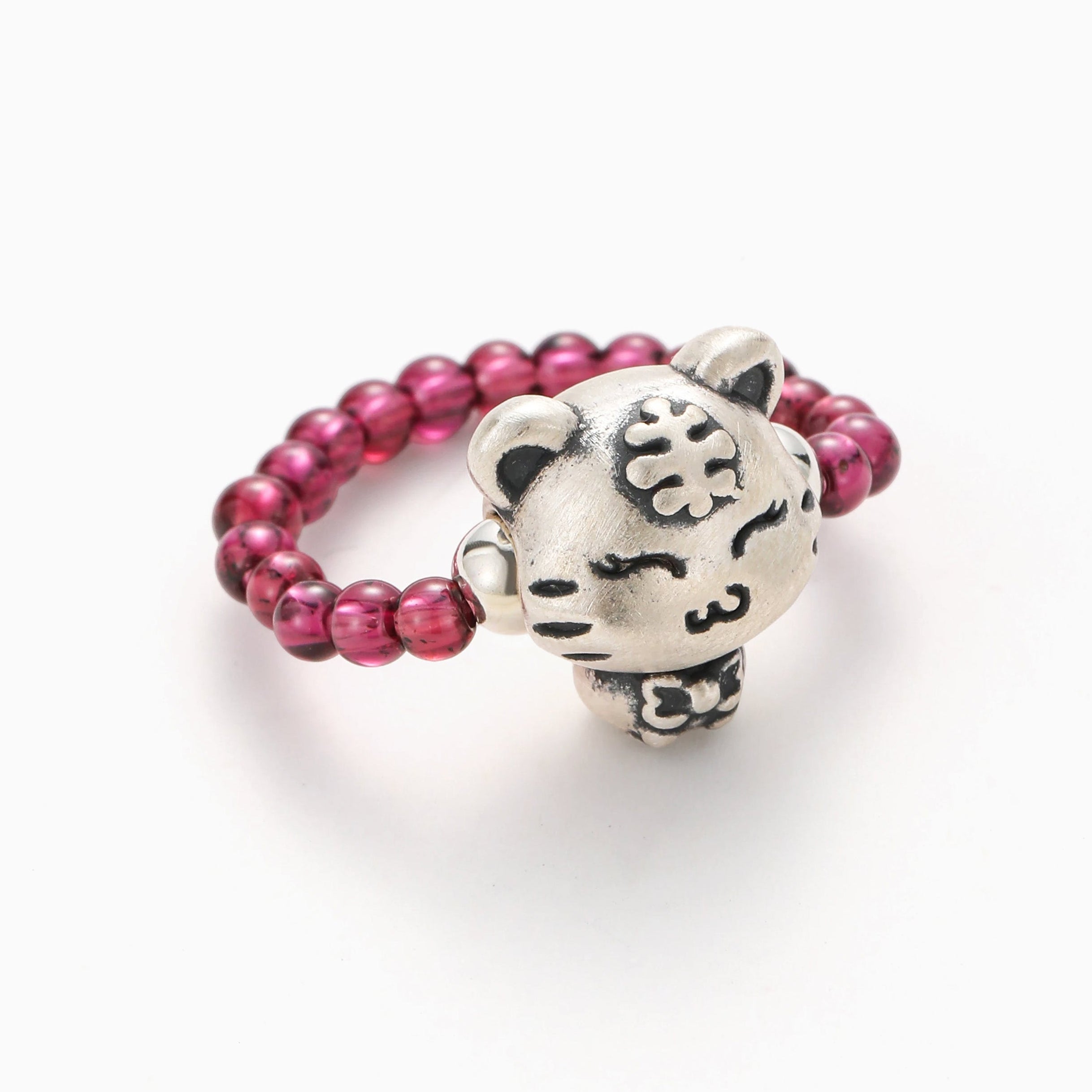 PURPLE GARNET STRETCH RING WITH STERLING SILVER TIGER CHARM