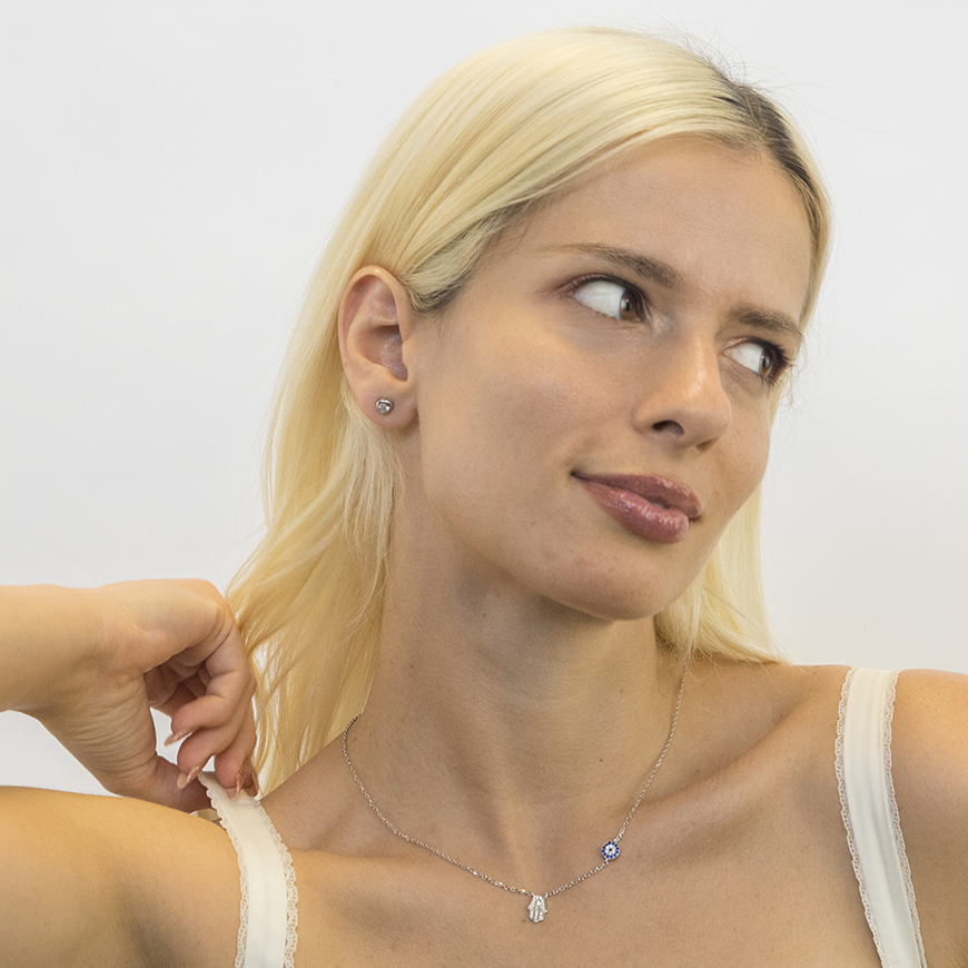 Blue evil eye charm with crystal accents on silver chain